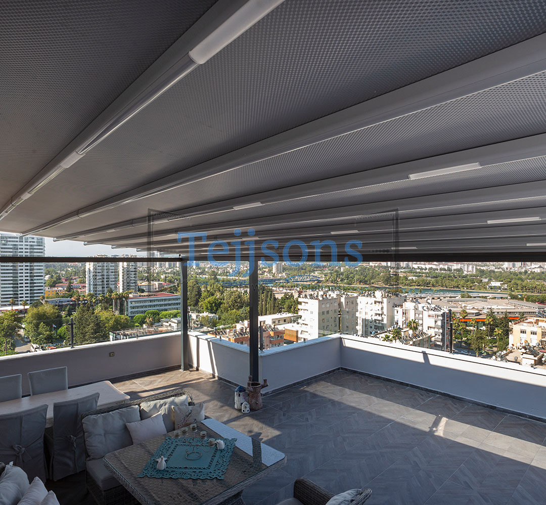 Retractable pergola on a rooftop terrace with city view