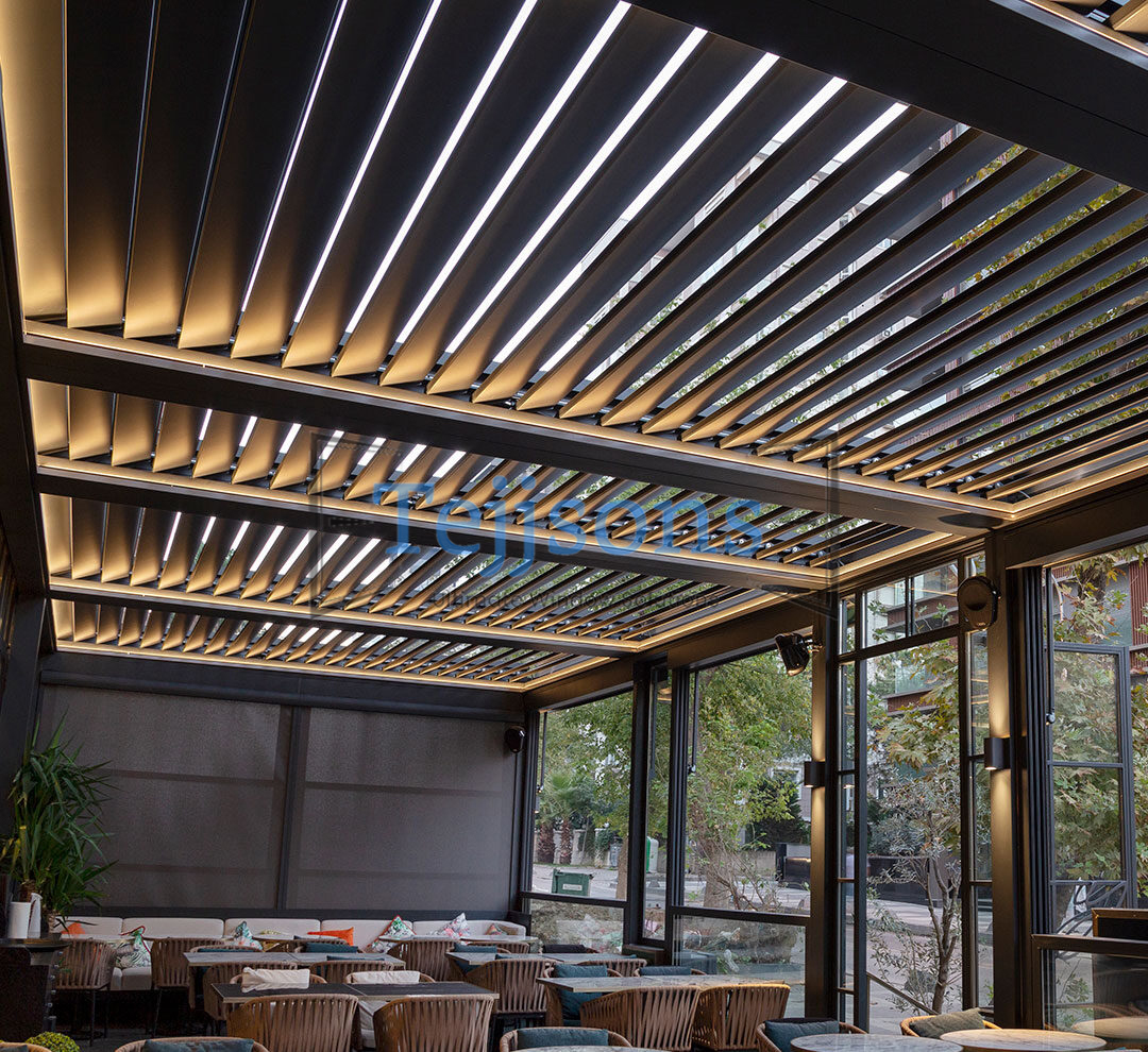 Bioclimatic pergola with adjustable louvers over a patio