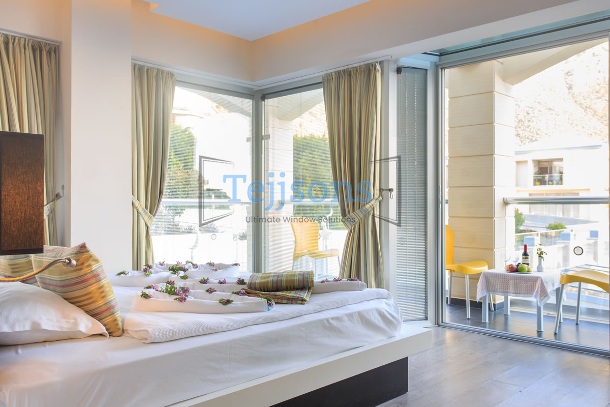 Modern bedroom with large windows and integrated double glazed blinds